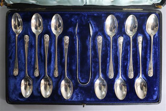 A cased set of twelve Victorian silver Old English silver teaspoons, London, 1882 and a pair of matched silver sugar tongs.